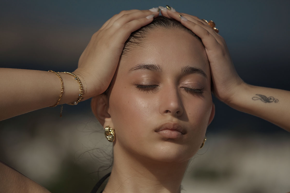 Soft-light windmill sunset portrait outtake in Mykonos, Greece
