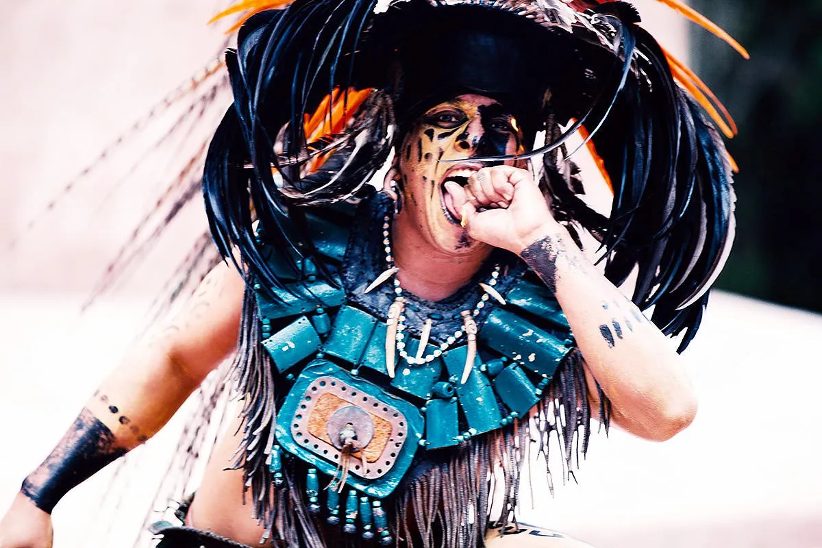 Mexican Aztec dancer in feathered headdress travel photography