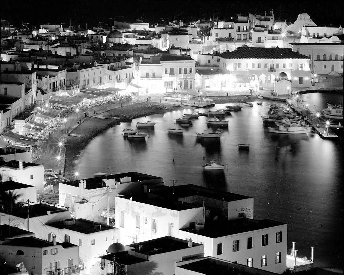 Black and white Mykonos harbor at night travel photography in Greece