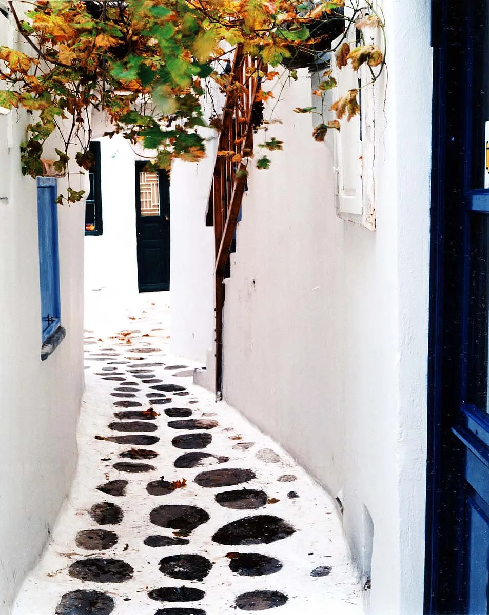 Vintage warm Cycladic lane travel photography