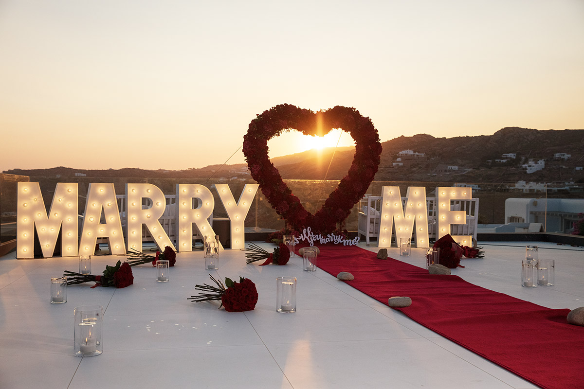Sunlit candid wedding proposal study in Mykonos, Greece