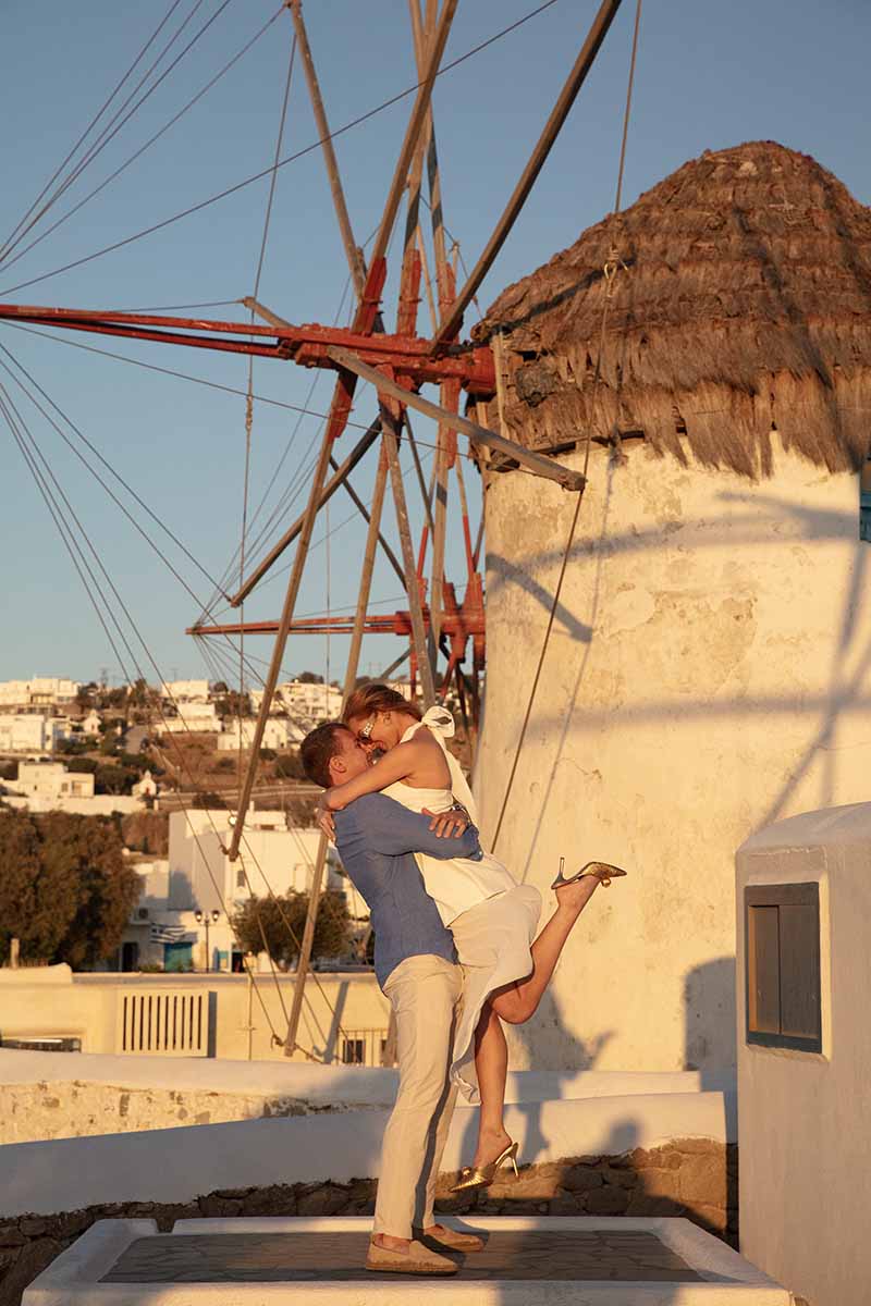 Sunlit candid wedding proposal shot in Mykonos, Greece