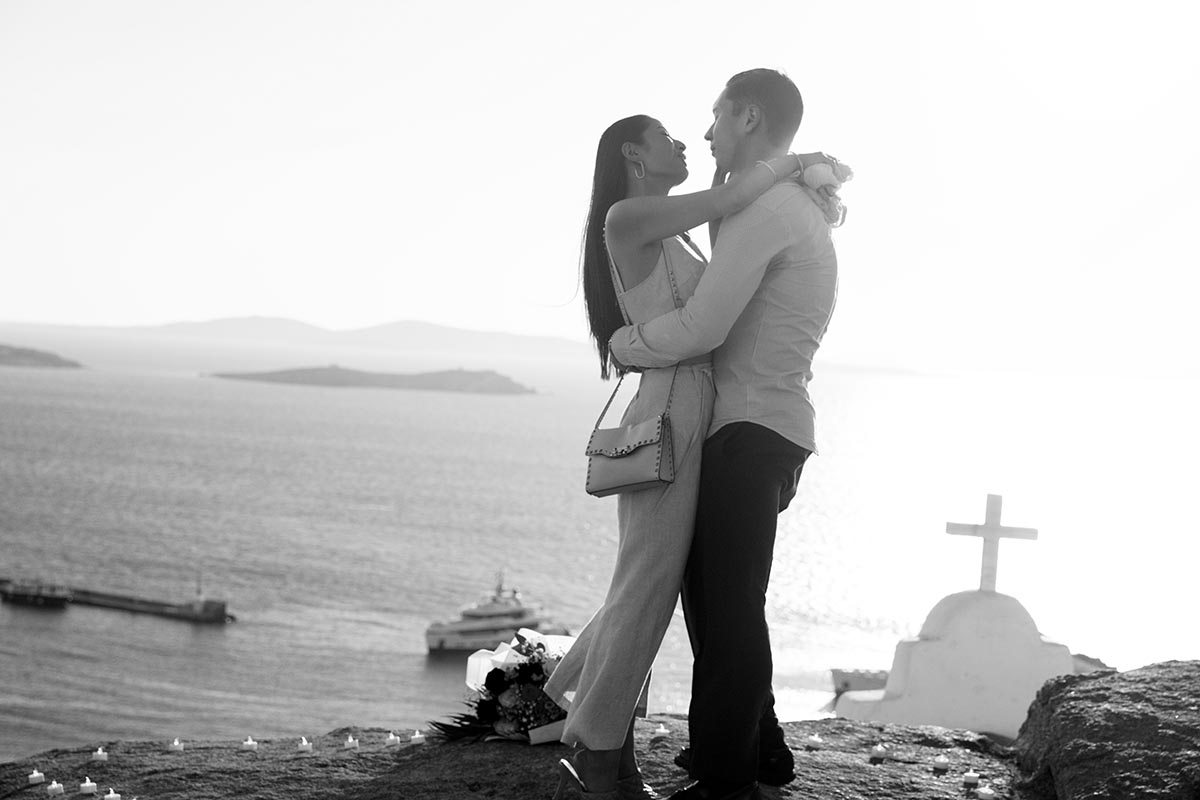 Sunlit rooftop wedding proposal outtake in Mykonos, Greece