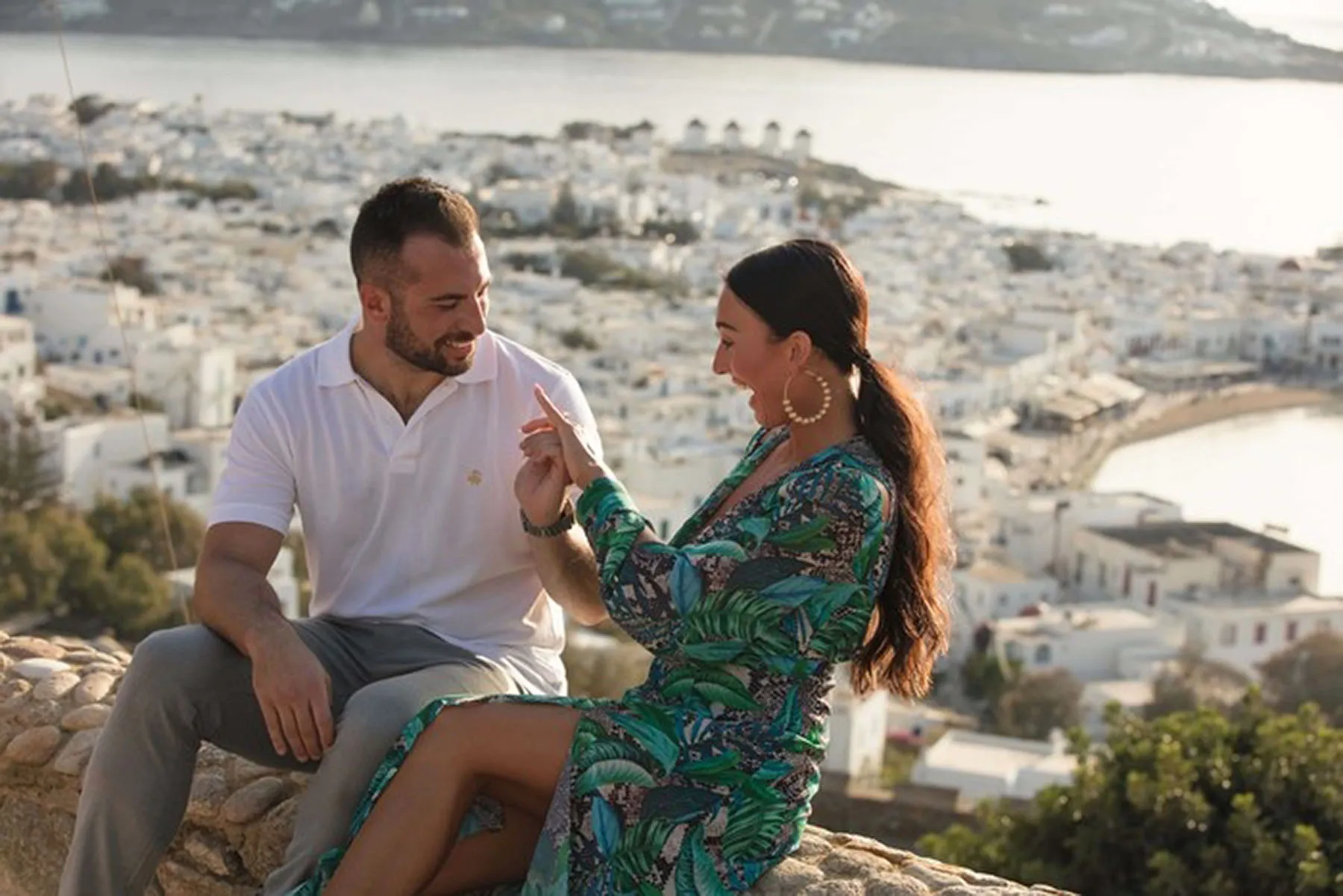 Sunlit stone arch wedding proposal study in Mykonos, Greece