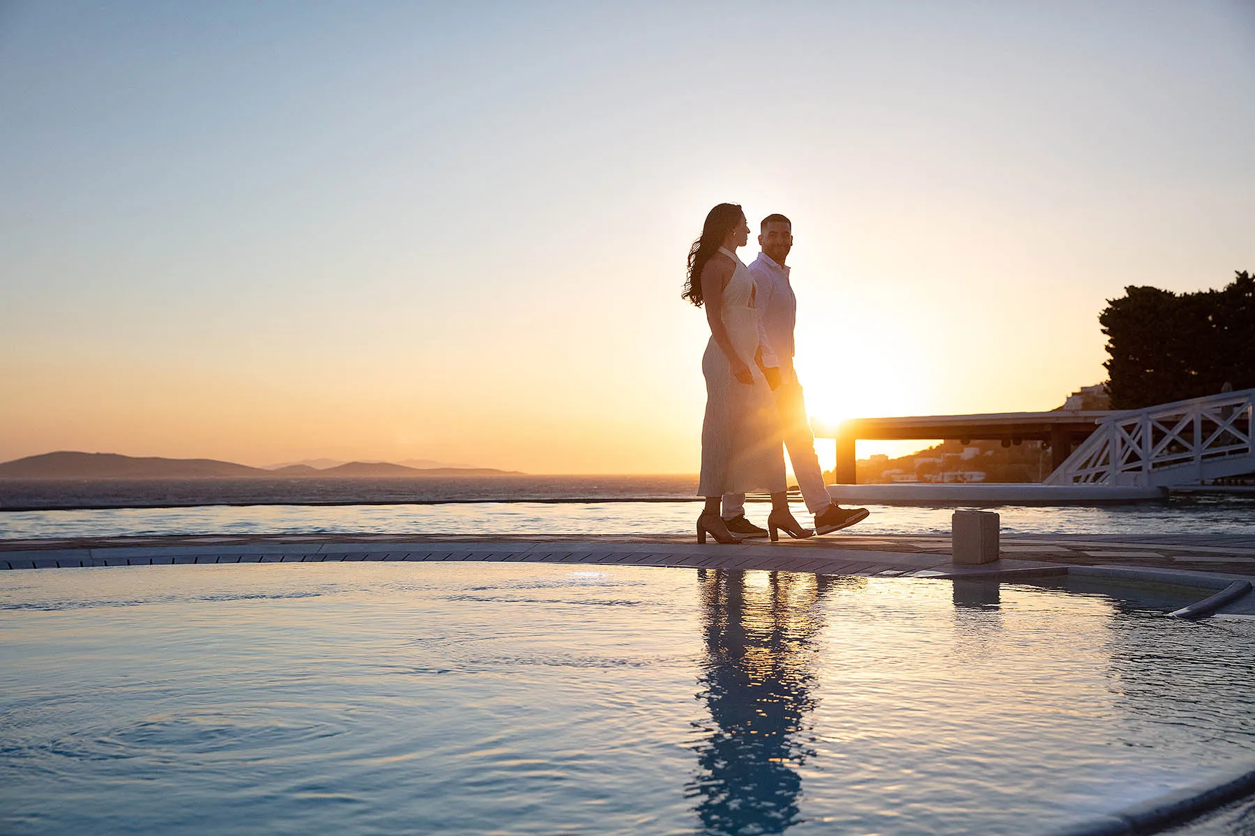 Sunlit sunset view wedding proposal composition in Mykonos, Greece