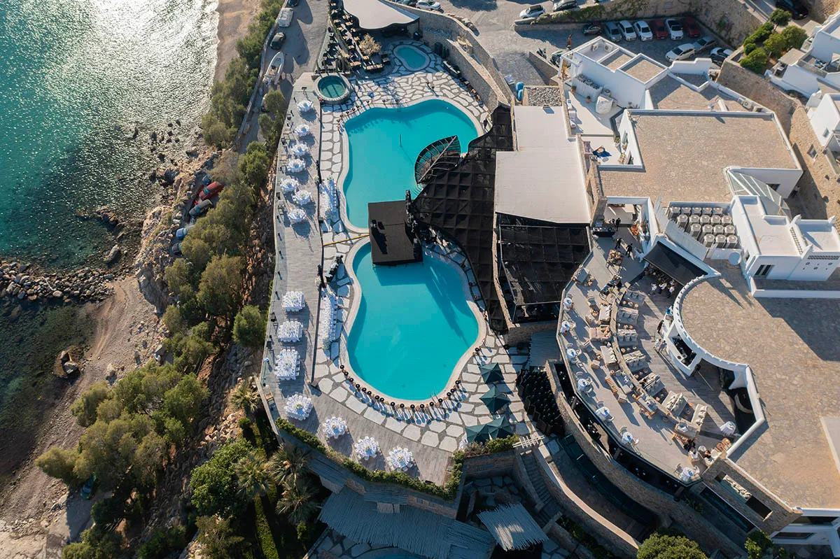 Sunlit aerial drone wedding photography on a Cycladic terrace, in Mykonos, Greece