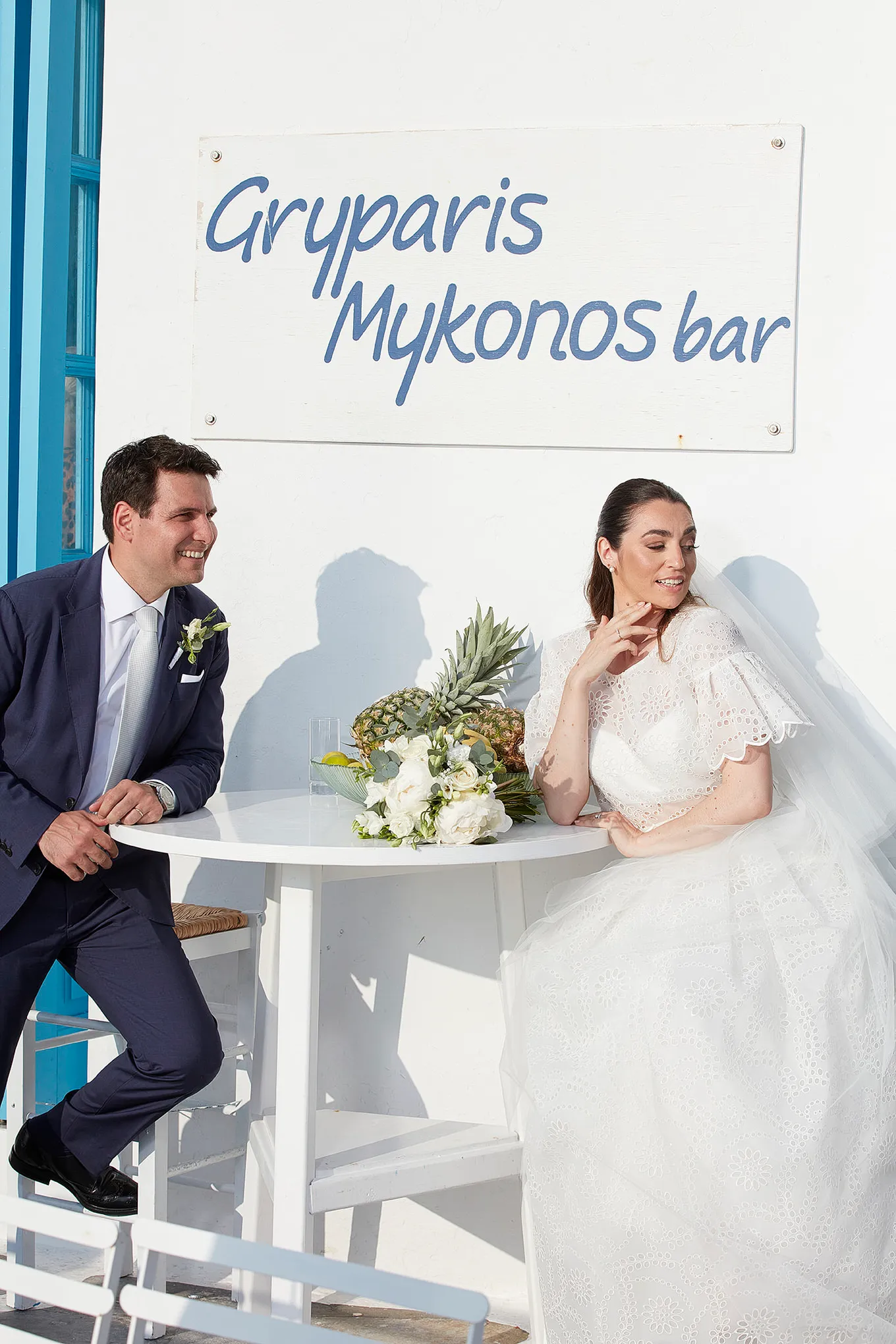 Sunlit aerial drone wedding photography in a Mykonos courtyard, in Mykonos, Greece