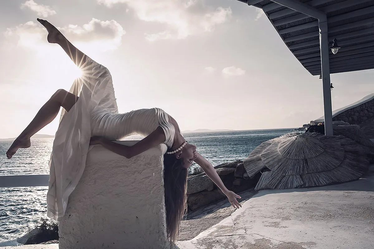 Sunlit arched bride creative wedding photography at a Mykonos villa, in Mykonos, Greece