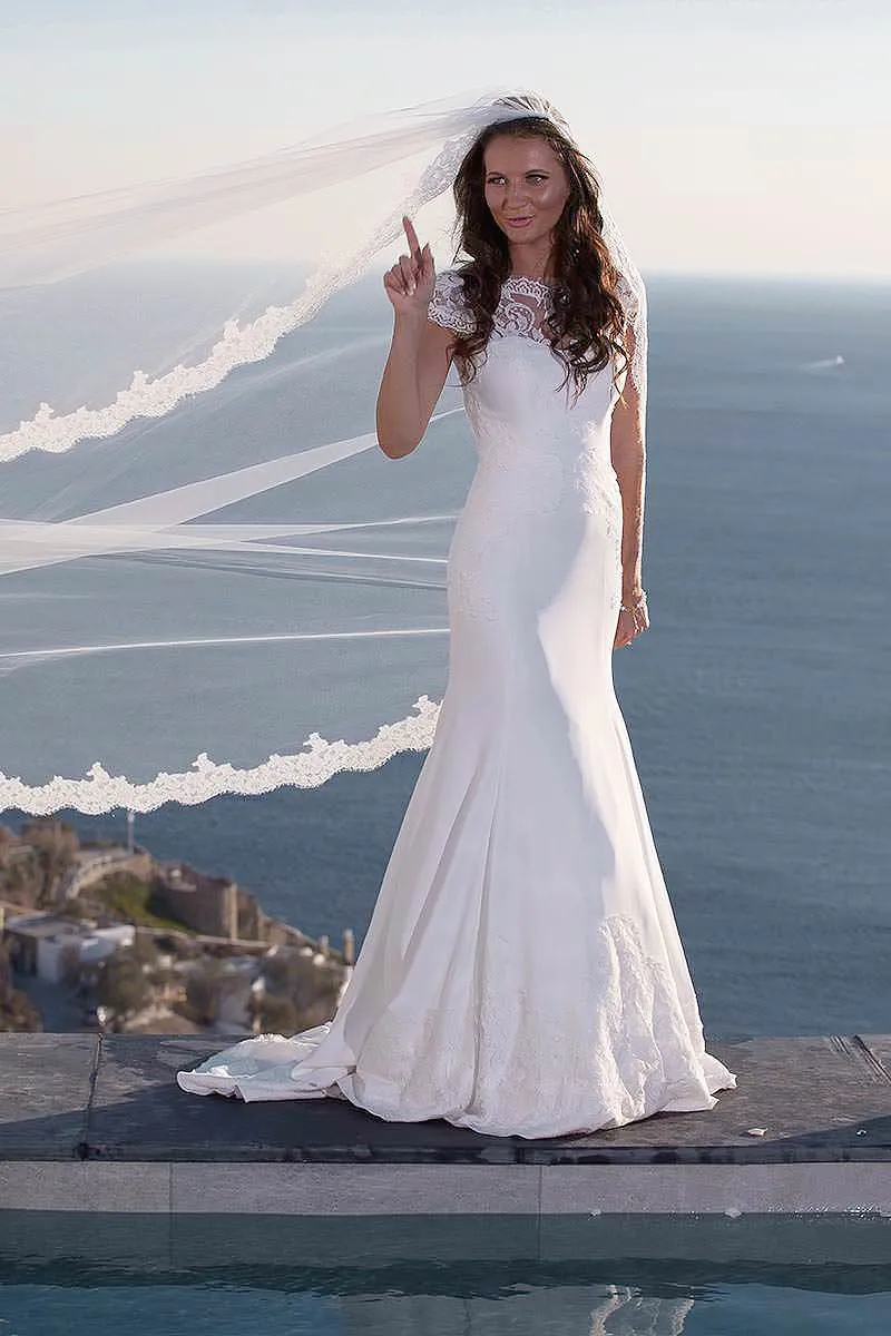 Sunlit arched bride creative wedding photography in a Mykonos courtyard, in Mykonos, Greece