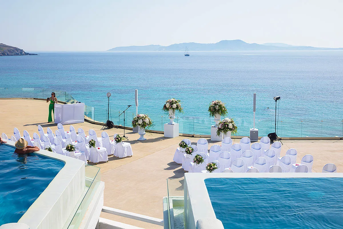 Sunlit beach wedding photography in a Mykonos courtyard, in Mykonos, Greece