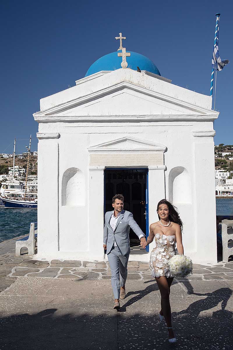 Sunlit bridal glow wedding photography on a sandy beach, in Mykonos, Greece