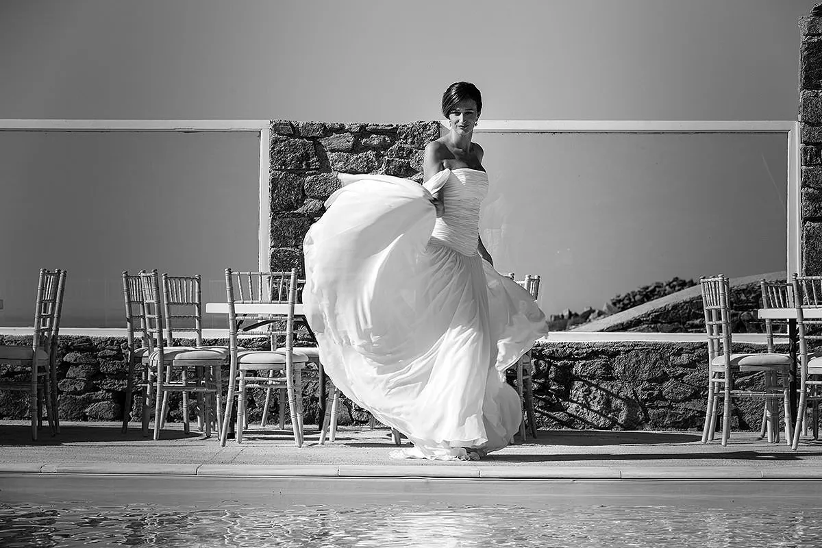 Sunlit bride portrait wedding photography on a sandy beach, in Mykonos, Greece