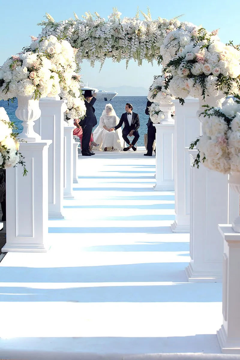 Sunlit altar ceremony wedding photography by the Aegean sea, in Mykonos, Greece