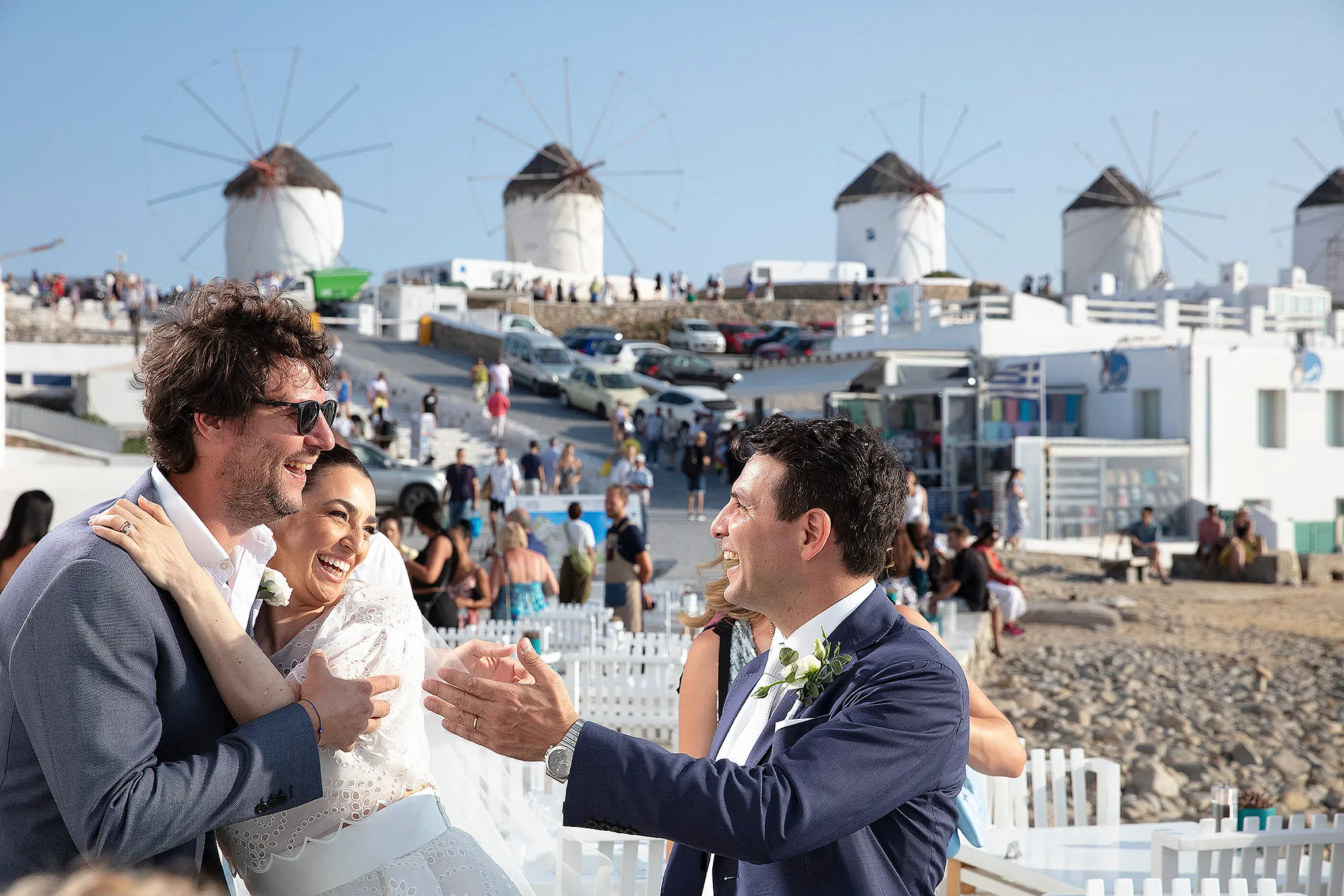 Sunlit ceremony wedding photography at a whitewashed chapel, in Mykonos, Greece
