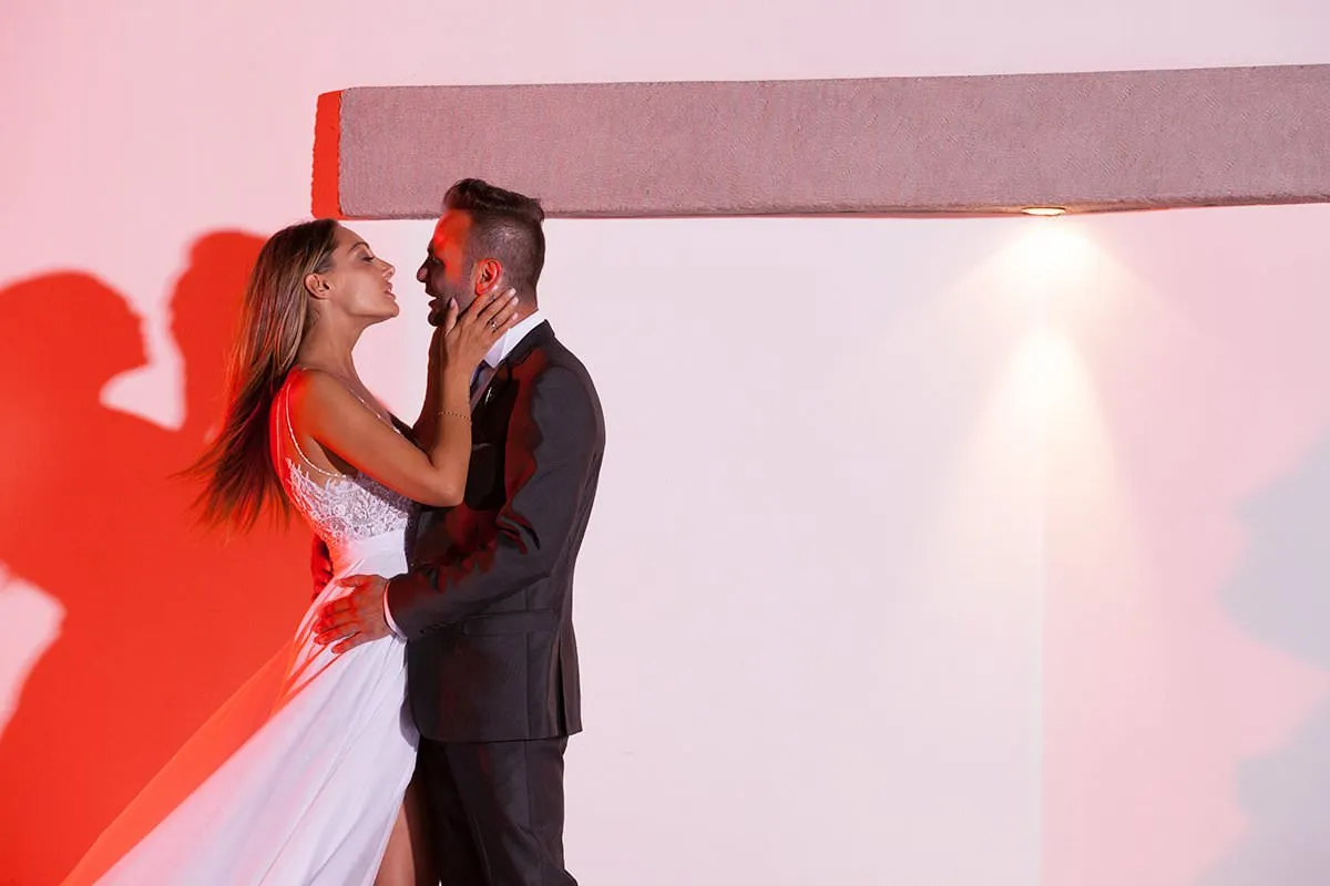 Sunlit classic wedding photography by the Aegean sea, in Mykonos, Greece