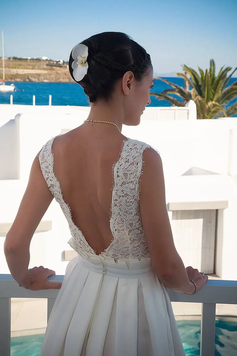 Sunlit classic wedding photography on a sandy beach, in Mykonos, Greece