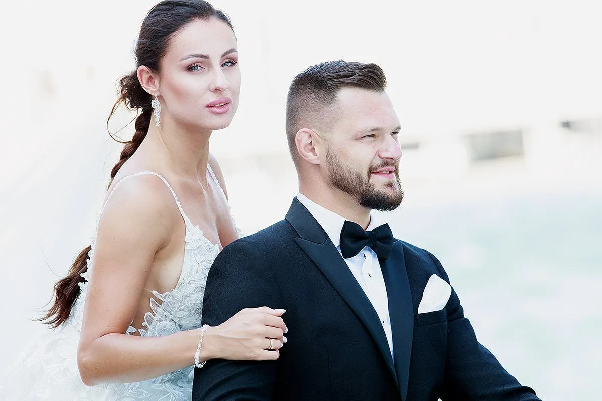 Sunlit clifftop wedding photography in a Mykonos courtyard, in Mykonos, Greece