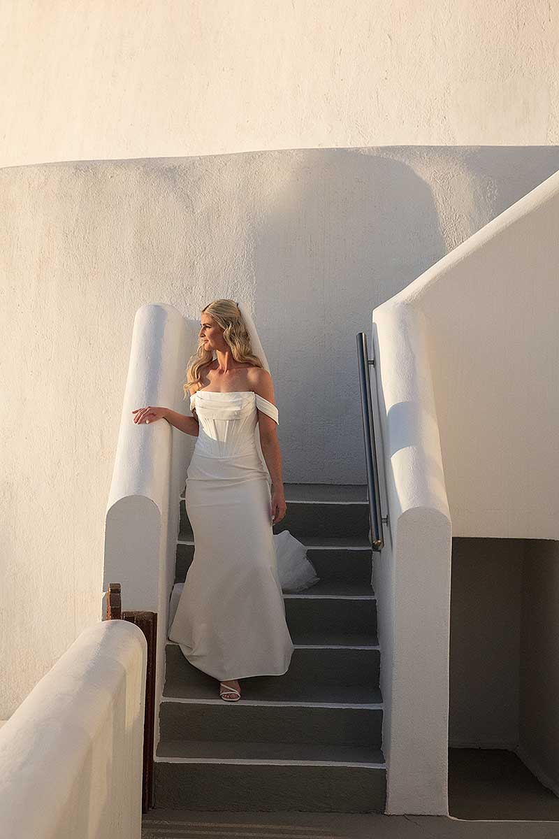 Sunlit Cycladic vow wedding photography in a Mykonos courtyard, in Mykonos, Greece