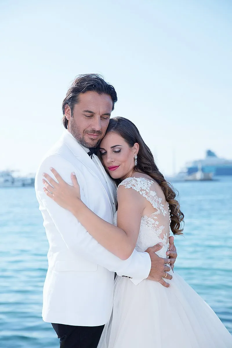 Sunlit dancefloor wedding photography by the Aegean sea, in Mykonos, Greece