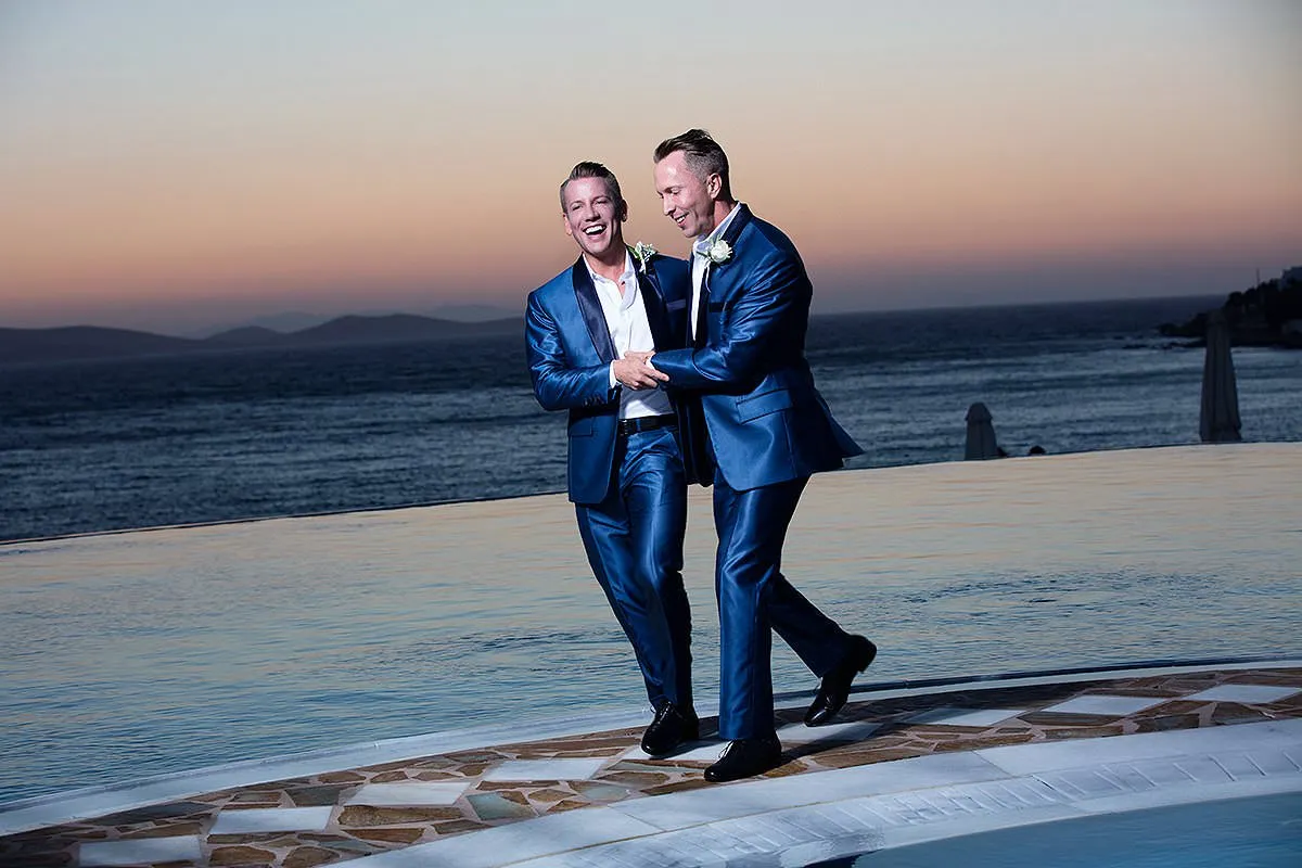 Sunlit dancefloor wedding photography on a Cycladic terrace, in Mykonos, Greece