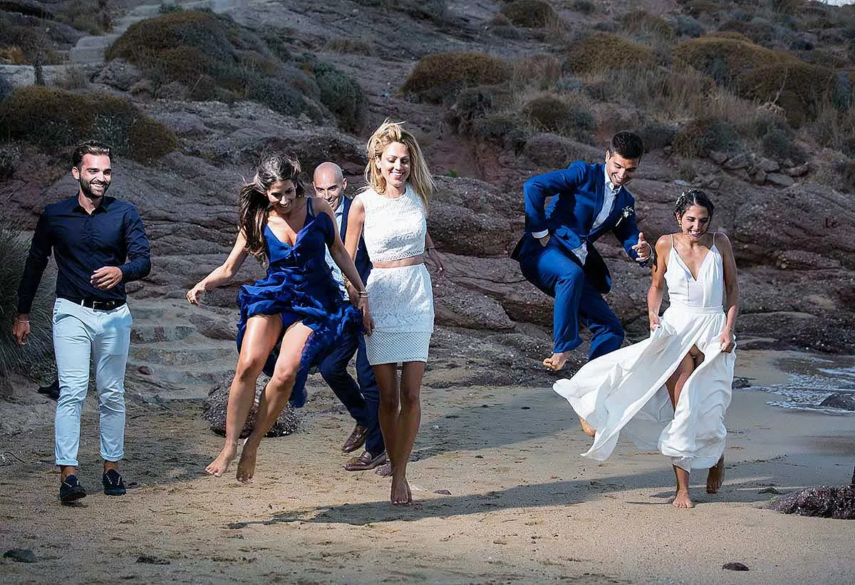 Sunlit dancefloor wedding photography in a Mykonos courtyard, in Mykonos, Greece