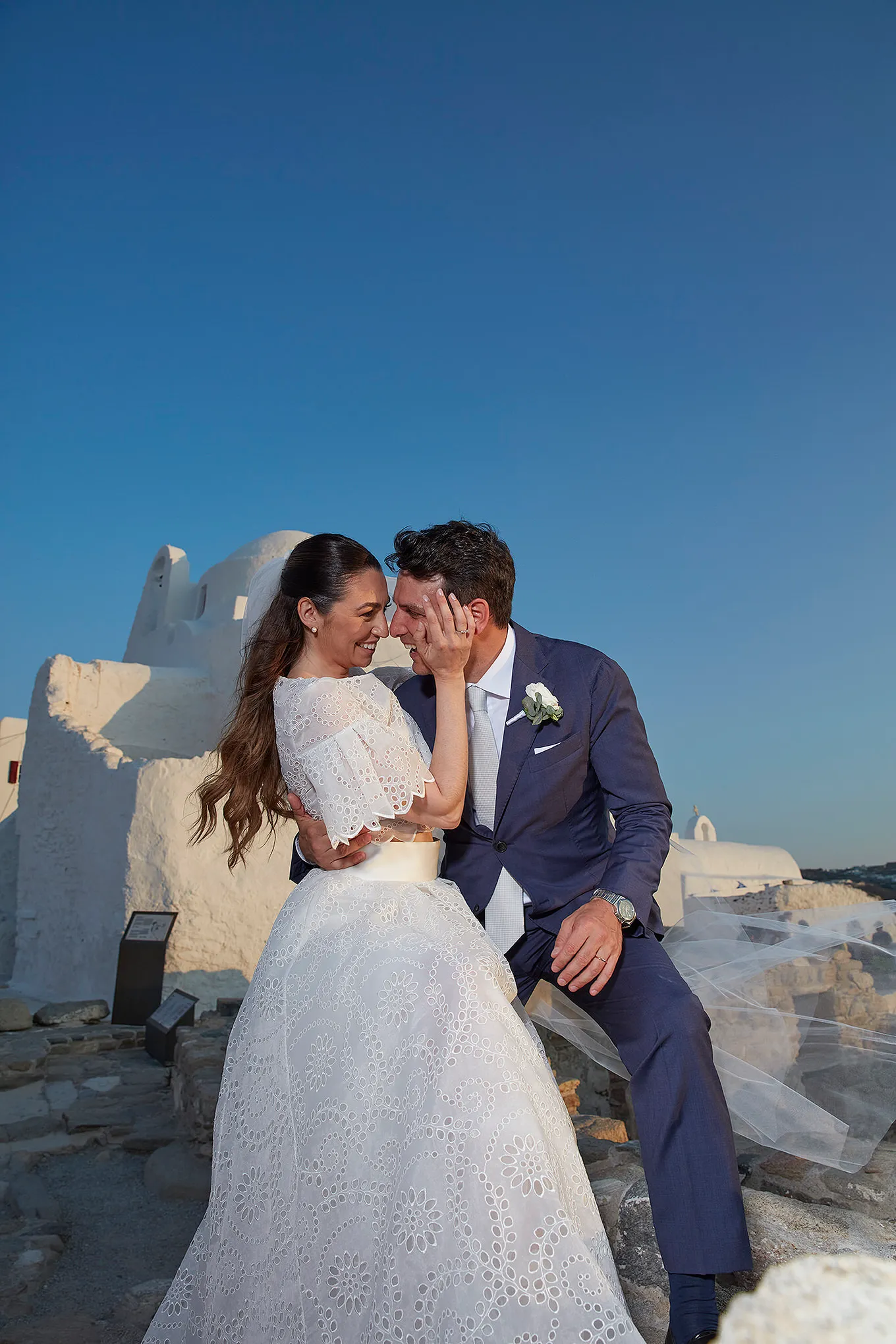 Sunlit documentary wedding photography on a Cycladic terrace, in Mykonos, Greece