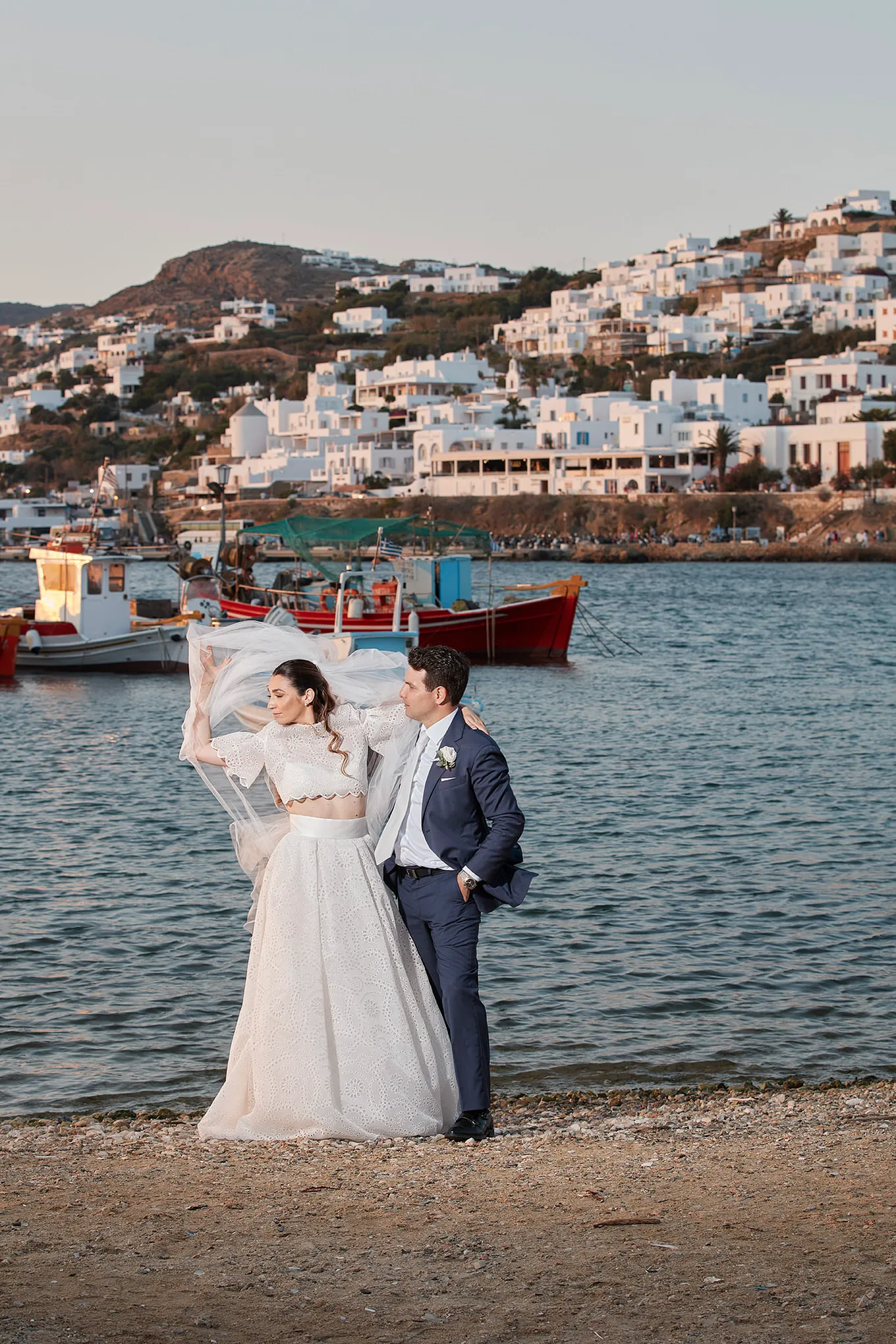 Sunlit documentary wedding photography in a Mykonos courtyard, in Mykonos, Greece
