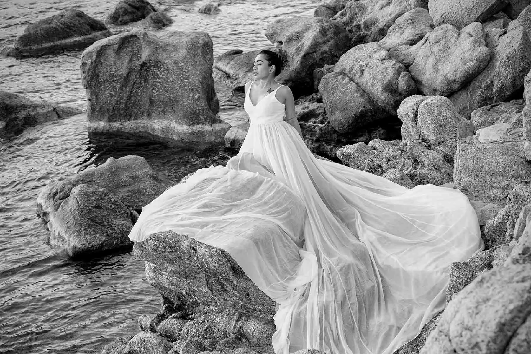 Sunlit editorial bridal wedding photography by the Aegean sea, in Mykonos, Greece