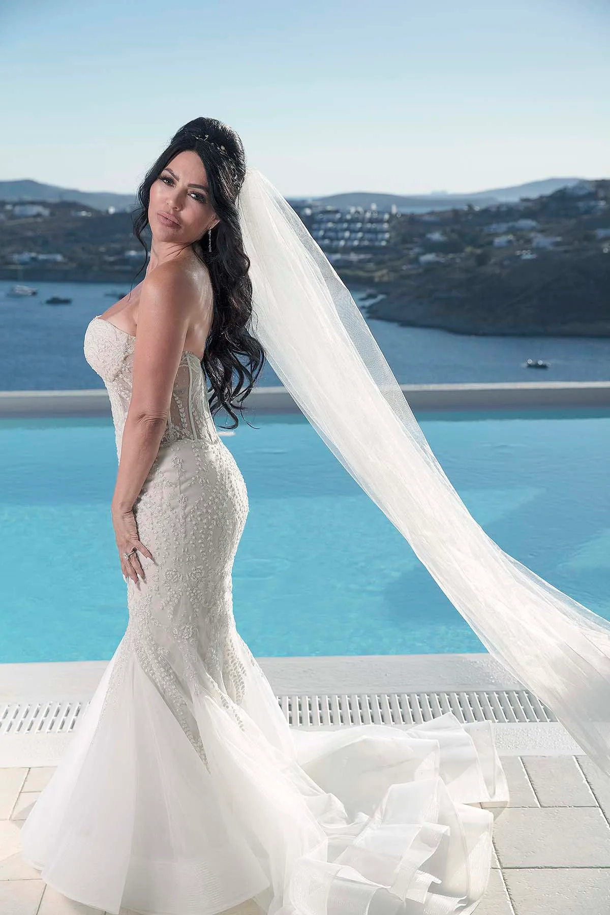 Sunlit editorial bridal wedding photography at a whitewashed chapel, in Mykonos, Greece