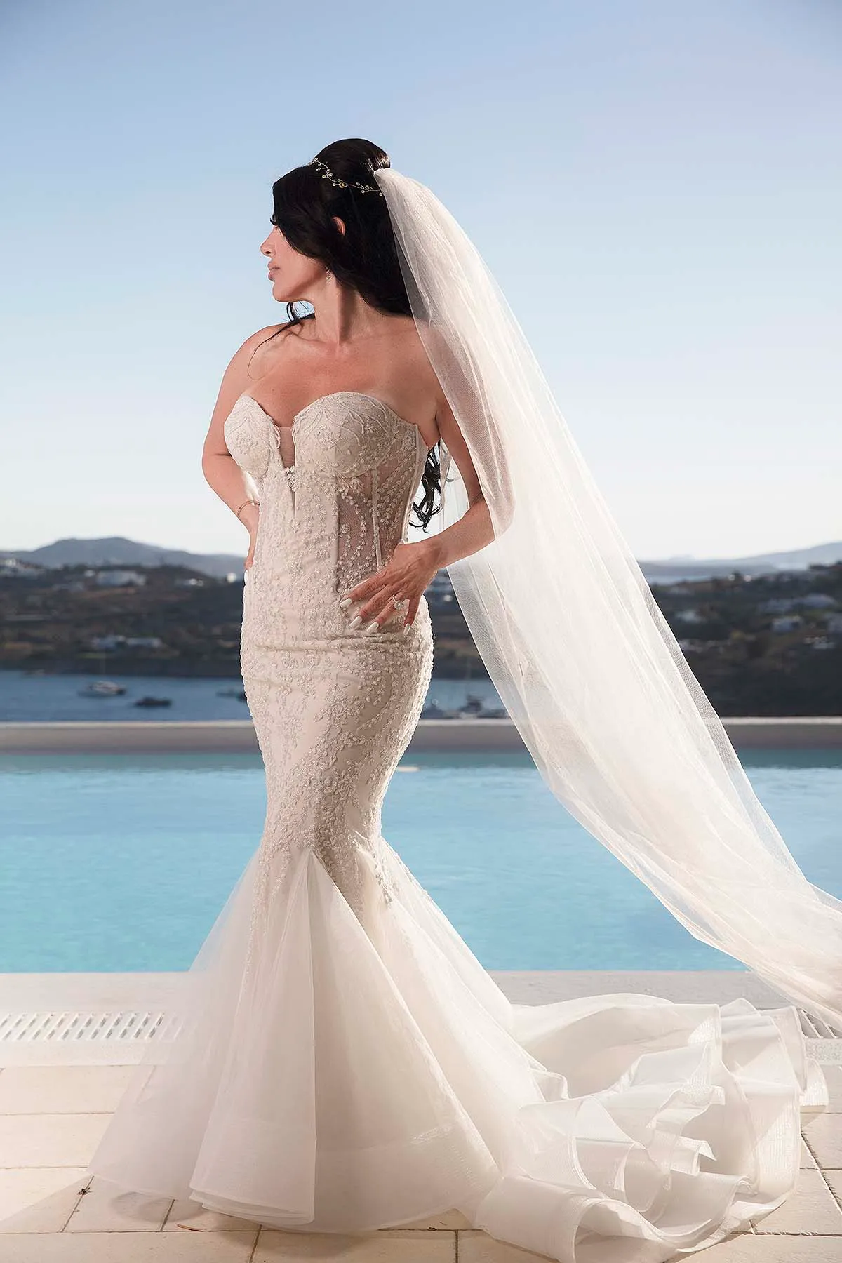 Sunlit editorial bridal wedding photography on a sandy beach, in Mykonos, Greece