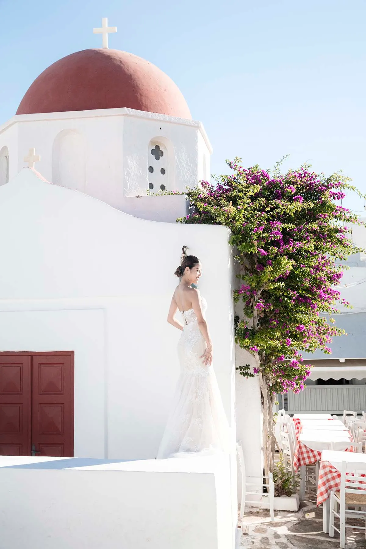Sunlit editorial bridal wedding photography in a Mykonos courtyard, in Mykonos, Greece