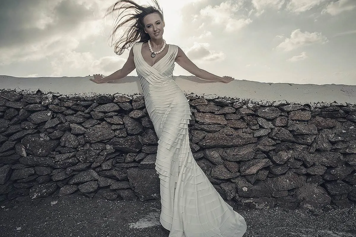 Sunlit editorial couple wedding photography by the Aegean sea, in Mykonos, Greece