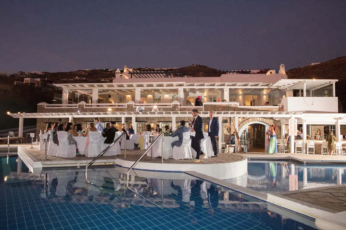 Sunlit garden wedding photography by the Aegean sea, in Mykonos, Greece