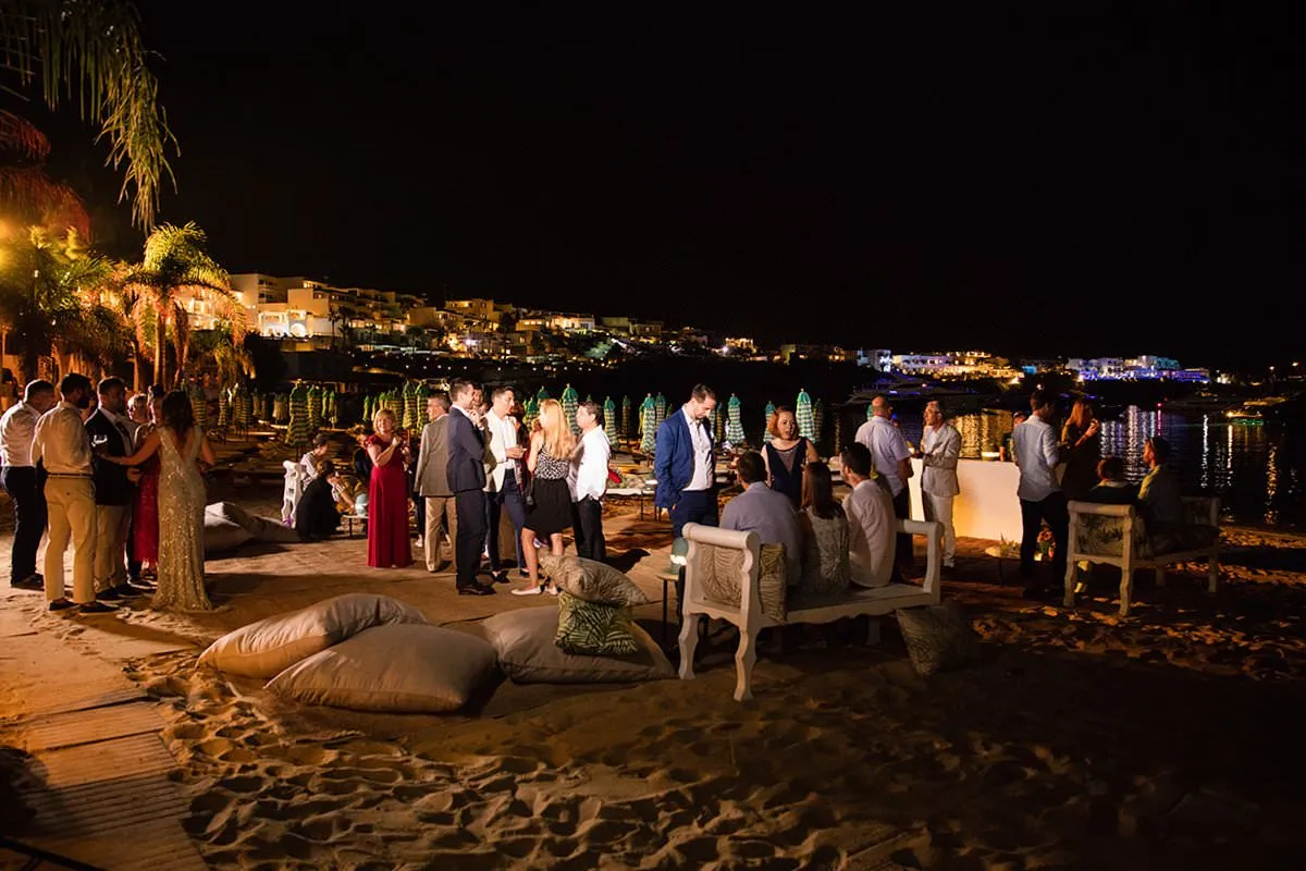 Sunlit garden wedding photography on a sandy beach, in Mykonos, Greece