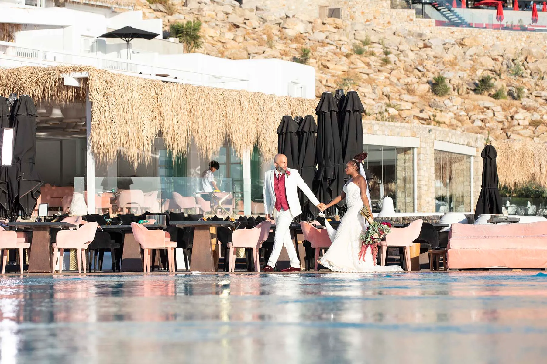 Sunlit golden hour wedding photography by the Aegean sea, in Mykonos, Greece