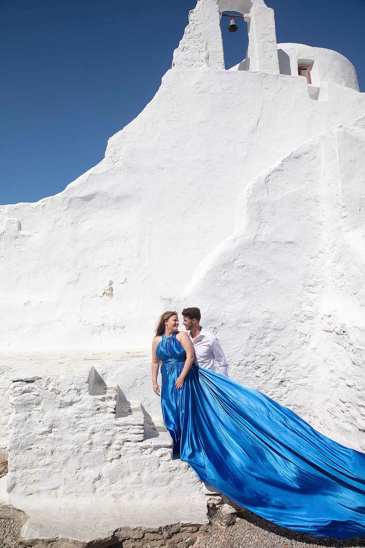 Sunlit golden hour wedding photography on a sandy beach, in Mykonos, Greece