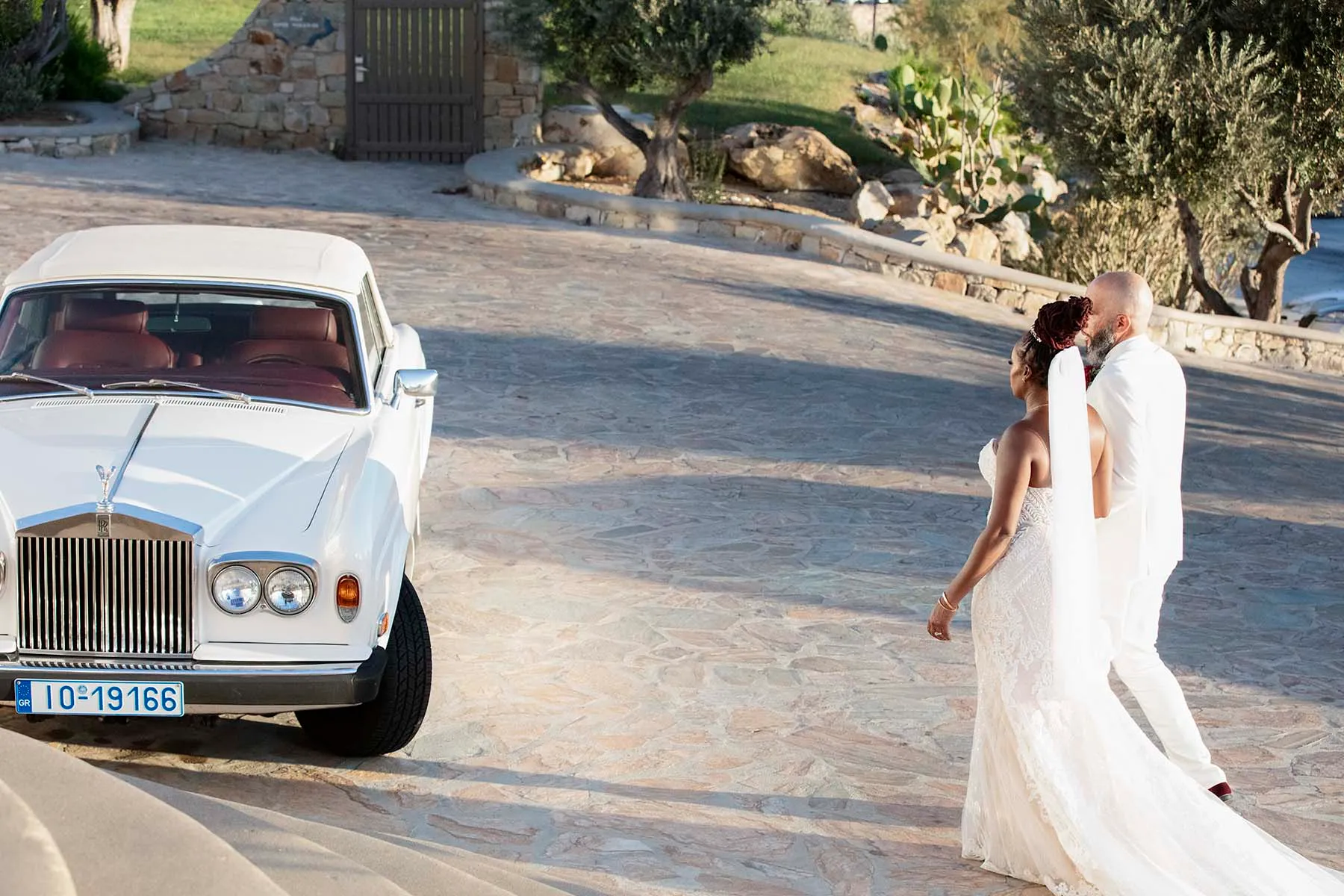 Sunlit golden hour wedding photography in a Mykonos courtyard, in Mykonos, Greece