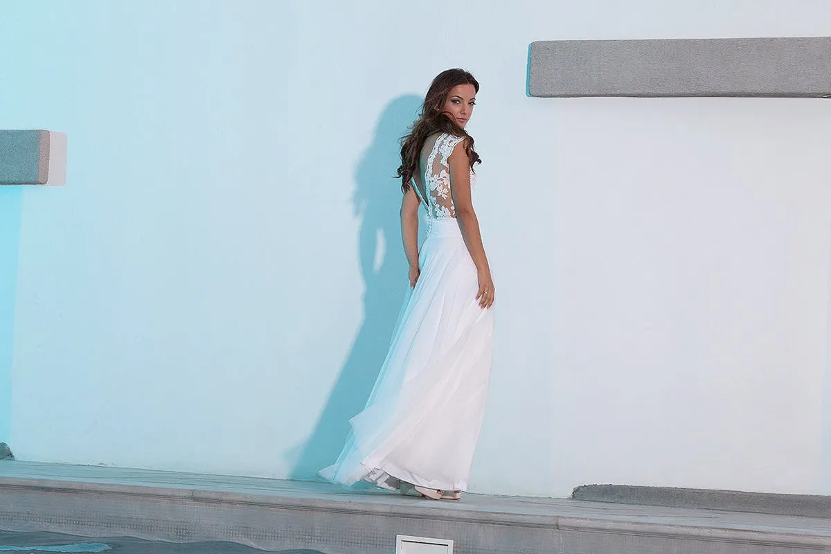 Sunlit groom editorial wedding photography by the Aegean sea, in Mykonos, Greece