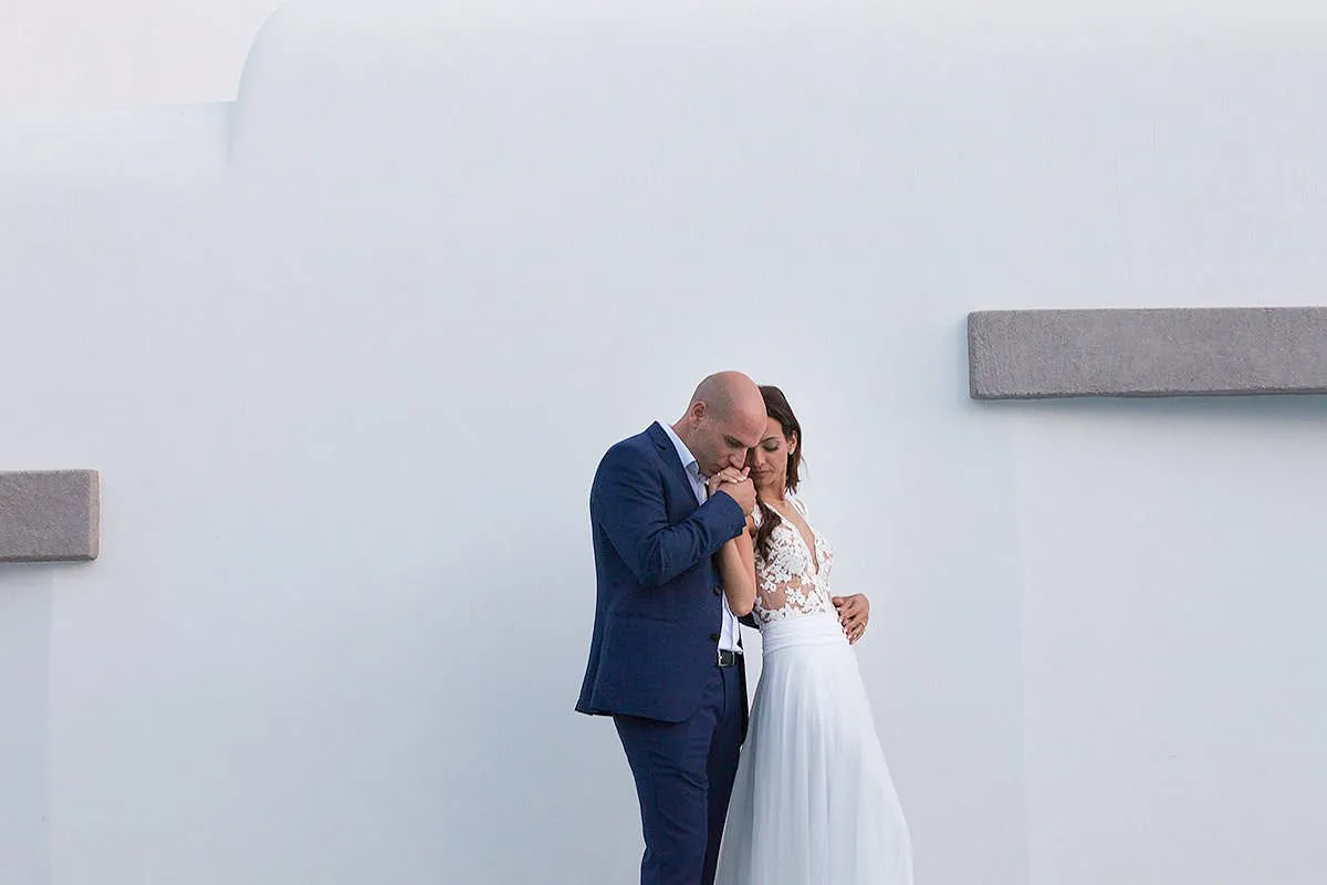 Sunlit groom editorial wedding photography on a Cycladic terrace, in Mykonos, Greece