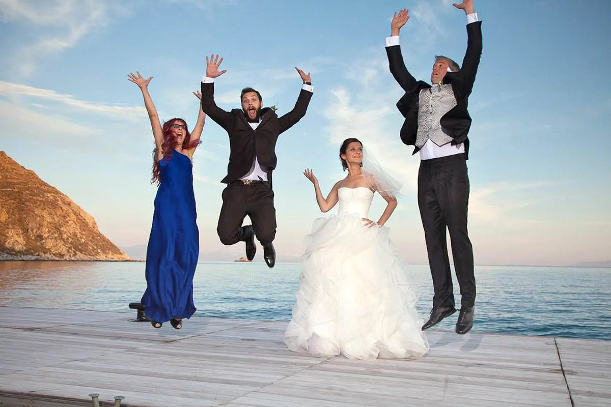 Sunlit groom portrait wedding photography on a Cycladic terrace, in Mykonos, Greece