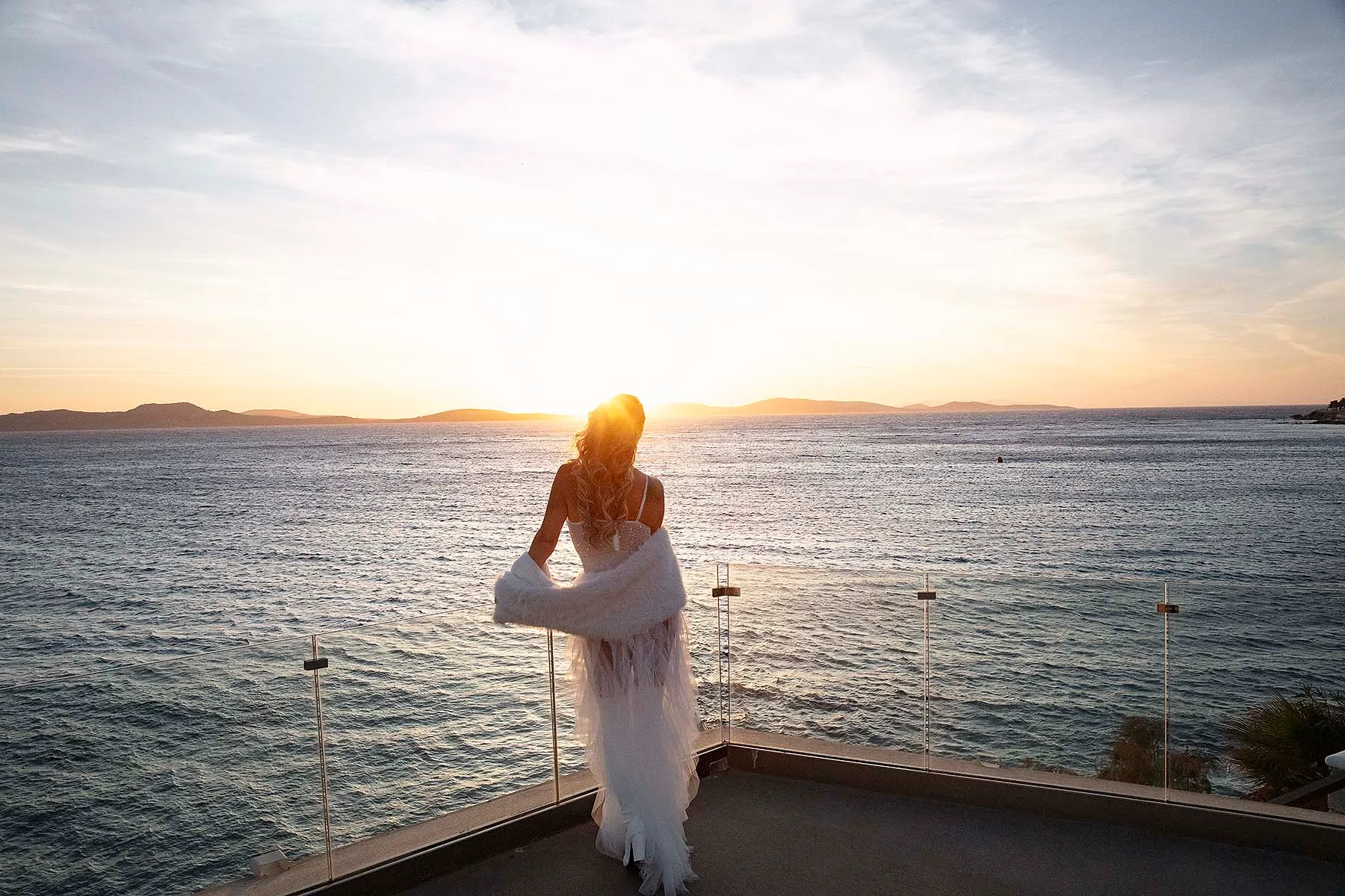 Sunlit harbor wedding photography on a Cycladic terrace, in Mykonos, Greece