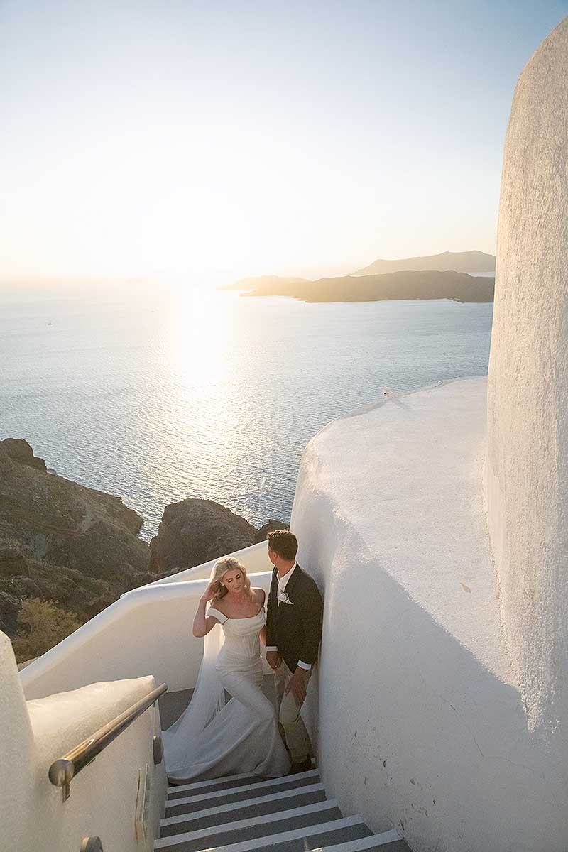Sunlit harbor wedding photography on a sandy beach, in Mykonos, Greece
