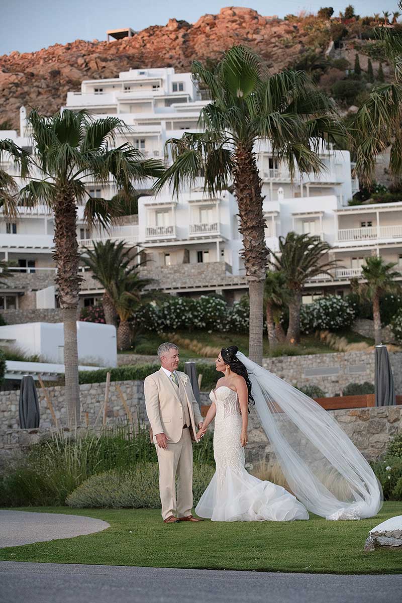 Sunlit luxe resort wedding photography on a Cycladic terrace, in Mykonos, Greece