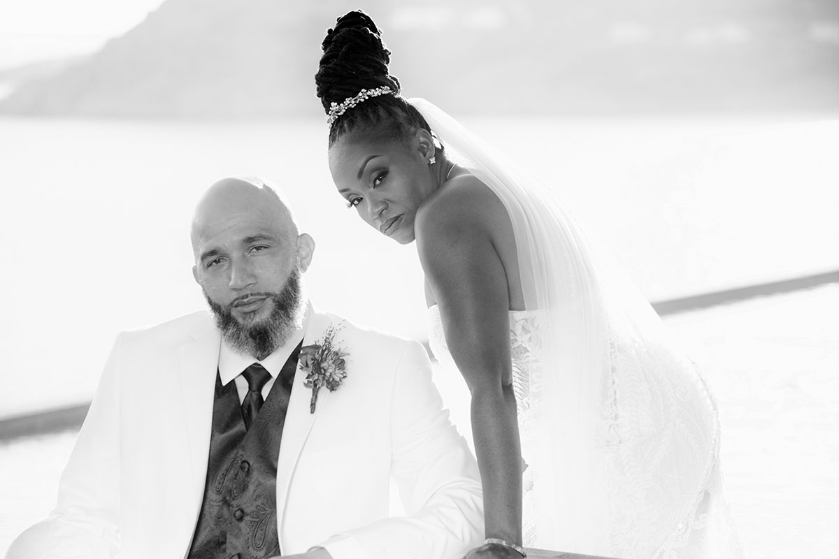 Sunlit luxe resort wedding photography at a whitewashed chapel, in Mykonos, Greece