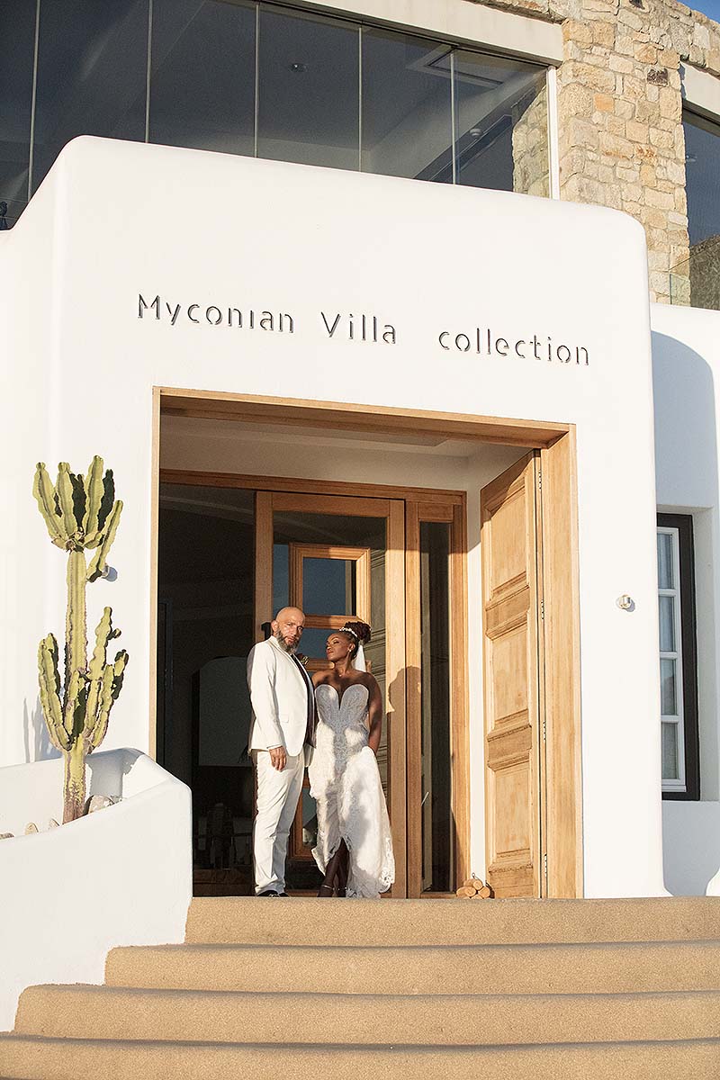 Sunlit luxe resort wedding photography in a Mykonos courtyard, in Mykonos, Greece