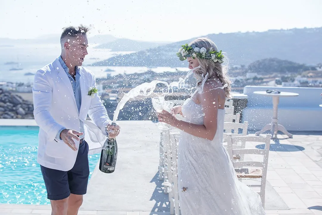Sunlit monochrome wedding photography by the Aegean sea, in Mykonos, Greece