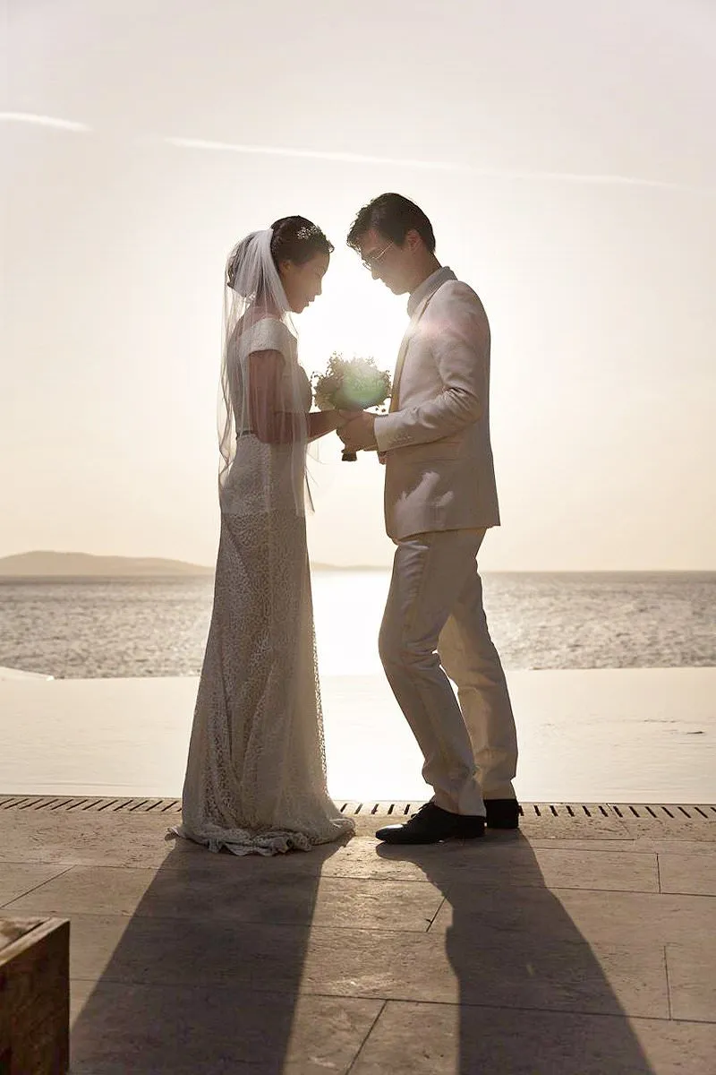 Sunlit monochrome wedding photography on a Cycladic terrace, in Mykonos, Greece
