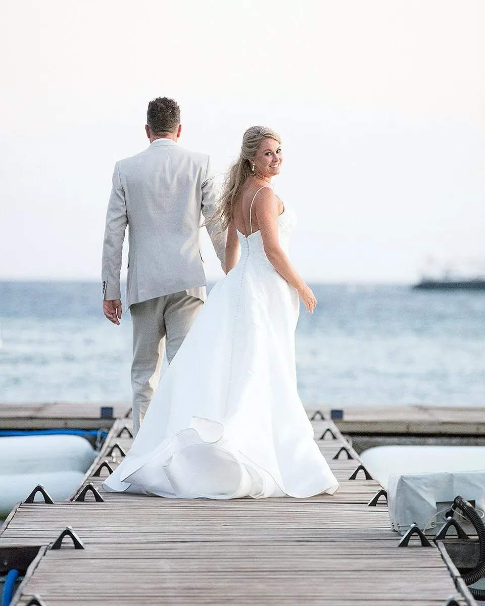 Sunlit monochrome wedding photography on a sandy beach, in Mykonos, Greece