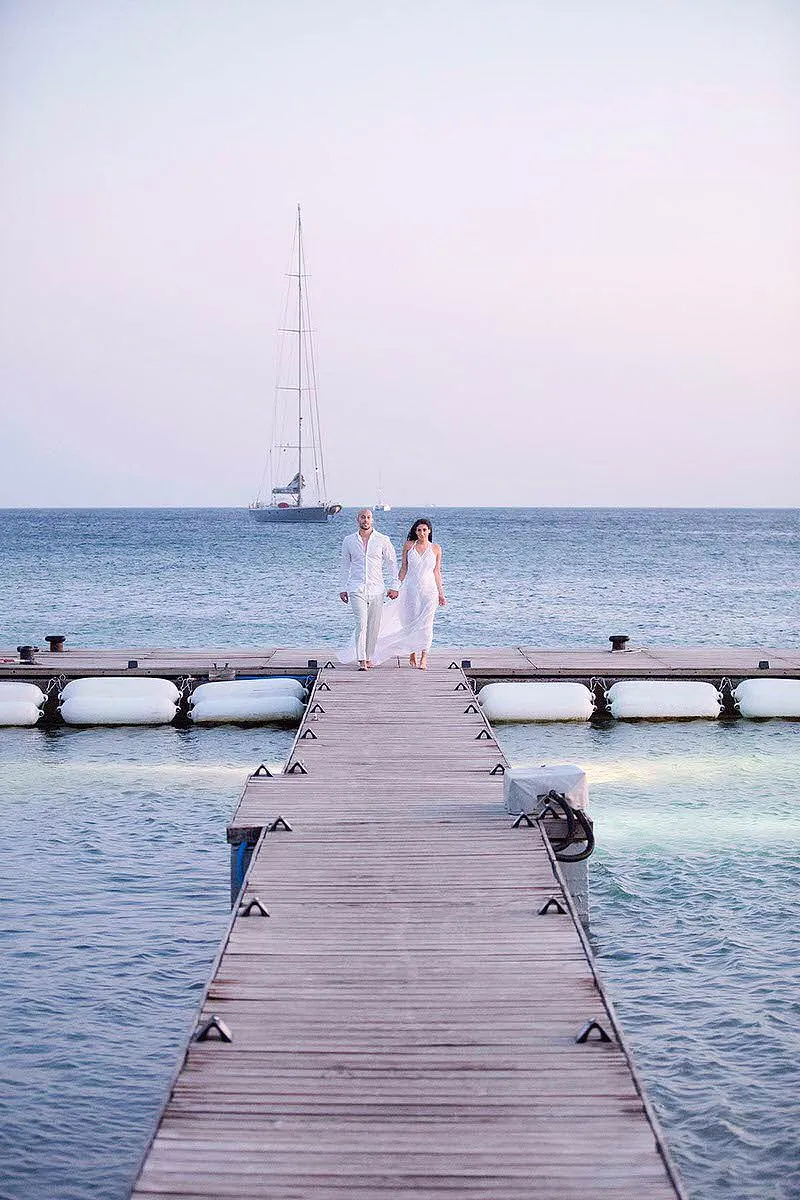 Sunlit reception wedding photography by the Aegean sea, in Mykonos, Greece
