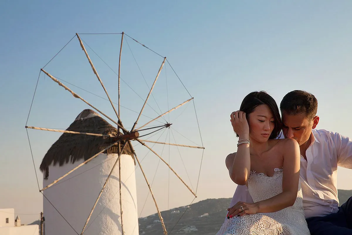 Sunlit romantic wedding photography by the Aegean sea, in Mykonos, Greece